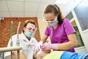 dentist and dental assistant during sedation dentistry